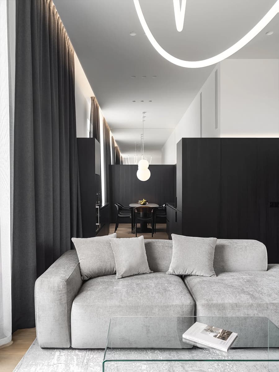Монохром, черные стеновые панели и лаконичные светильники в квартире для холостяка — проект Артема Алексеева