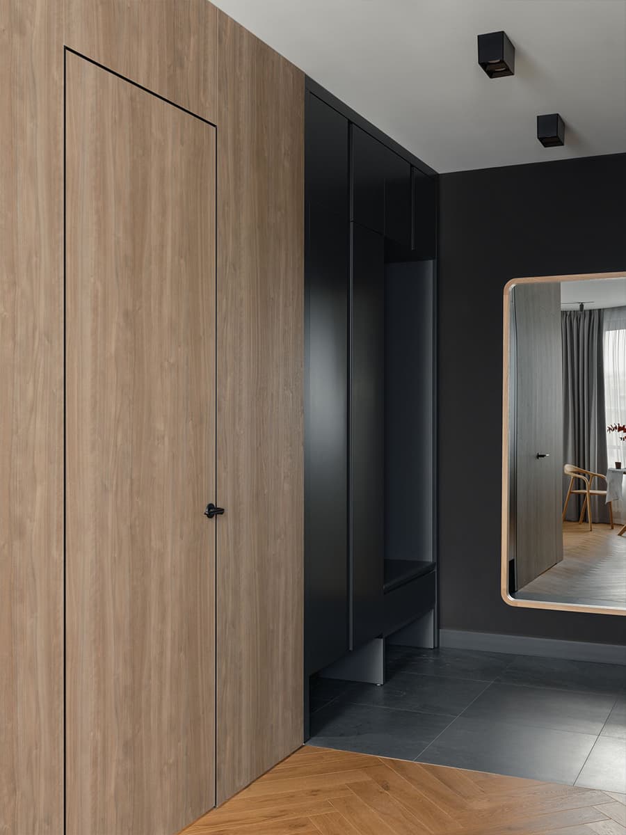 Красные акценты и скрытые двери в современном интерьере квартиры — проект студии Black Wall