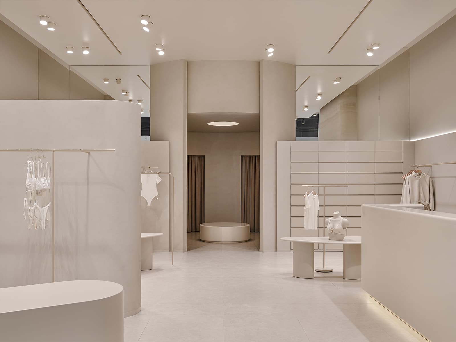 Визуальный покой и скругленные формы в интерьере магазина белья — проект бюро SINITSA