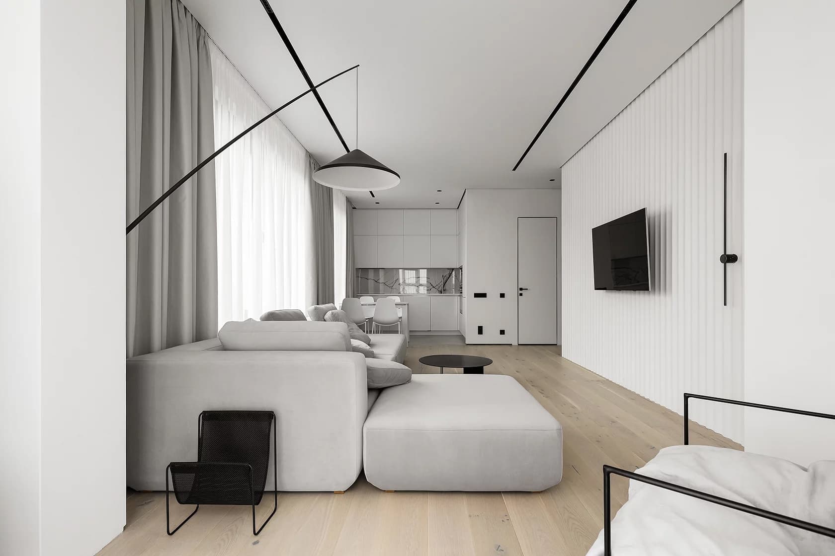 Монохромный интерьер квартиры с созданной на заказ мягкой группой — проект Станислава Бороздинского